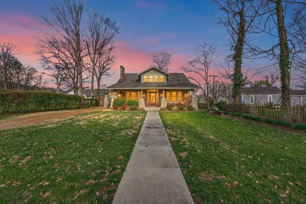 a view of house with a garden