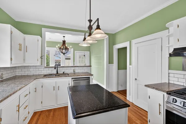 a kitchen with a sink and cabinets