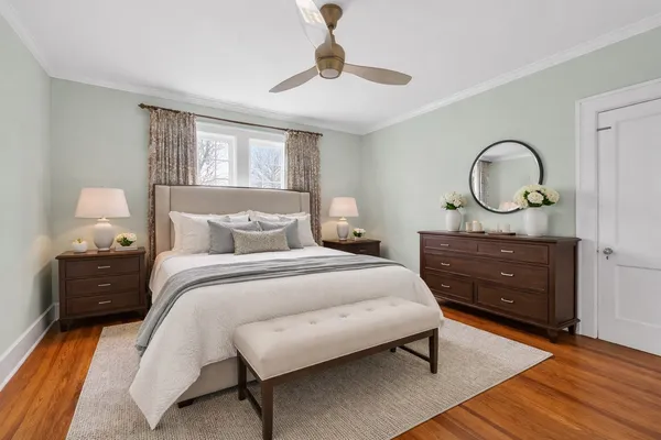 a spacious bedroom with a bed and furniture