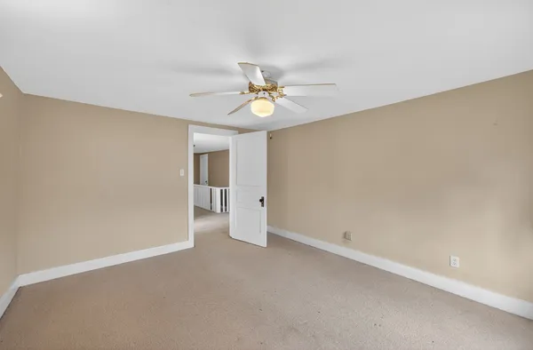 a bathroom with a double vanity sink toilet and shower