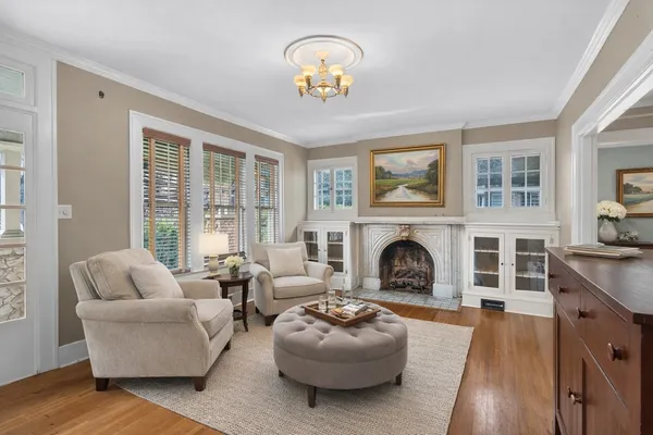 a view of livingroom with furniture wooden floor and windows