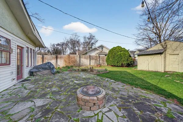 a view of a backyard of the house