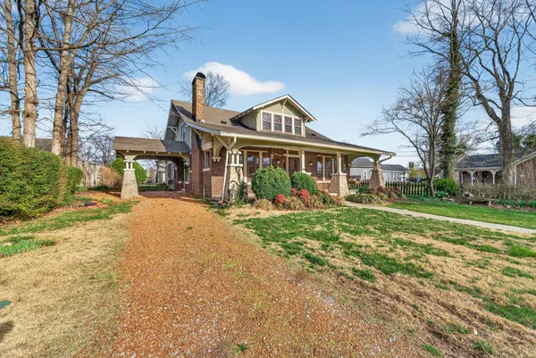 an aerial view of a residential apartment building with a yard