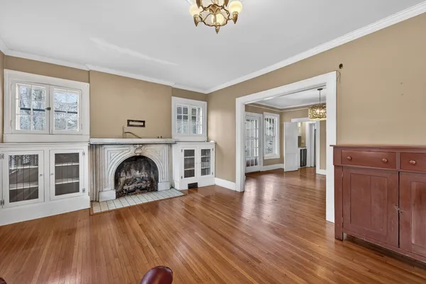 a view of a dining room with furniture wooden floor and chandelier