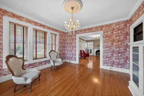 a kitchen with granite countertop a sink a stove and refrigerator