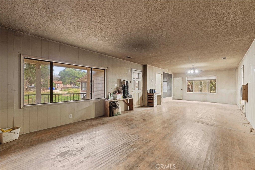 24811 Meadview Avenue Newhall, CA 91321 - Photo 26 of 73 a large white room with a large window and sitting area