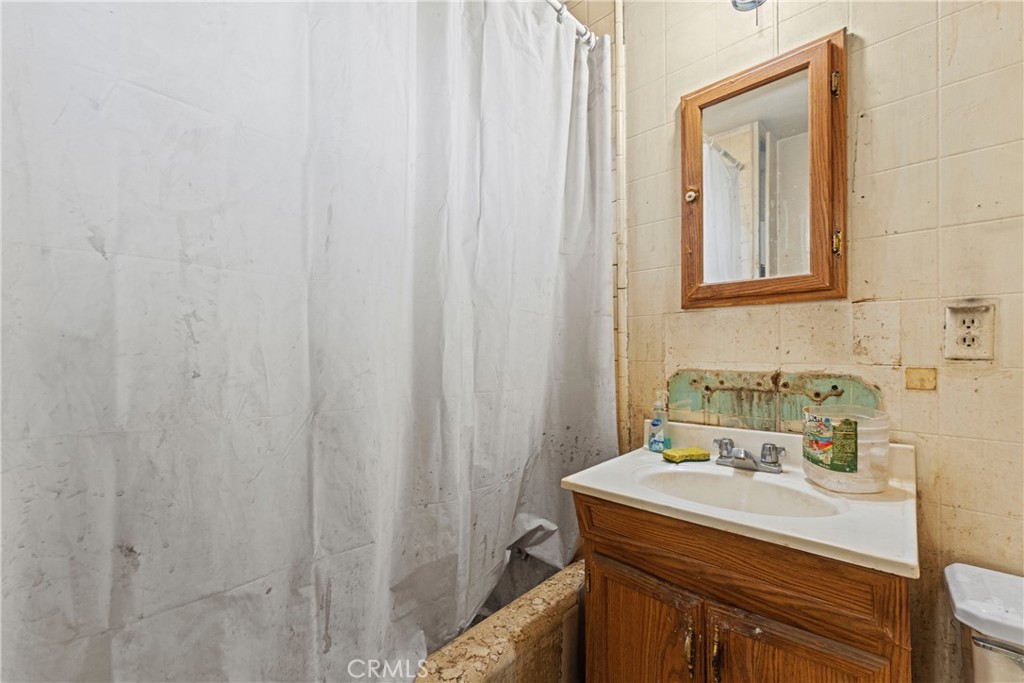 24811 Meadview Avenue Newhall, CA 91321 - Photo 35 of 73 a bathroom with a sink and a mirror