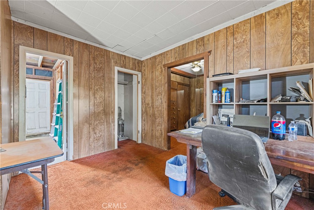 24811 Meadview Avenue Newhall, CA 91321 - Photo 40 of 73 a living room with furniture a flat screen tv and a table