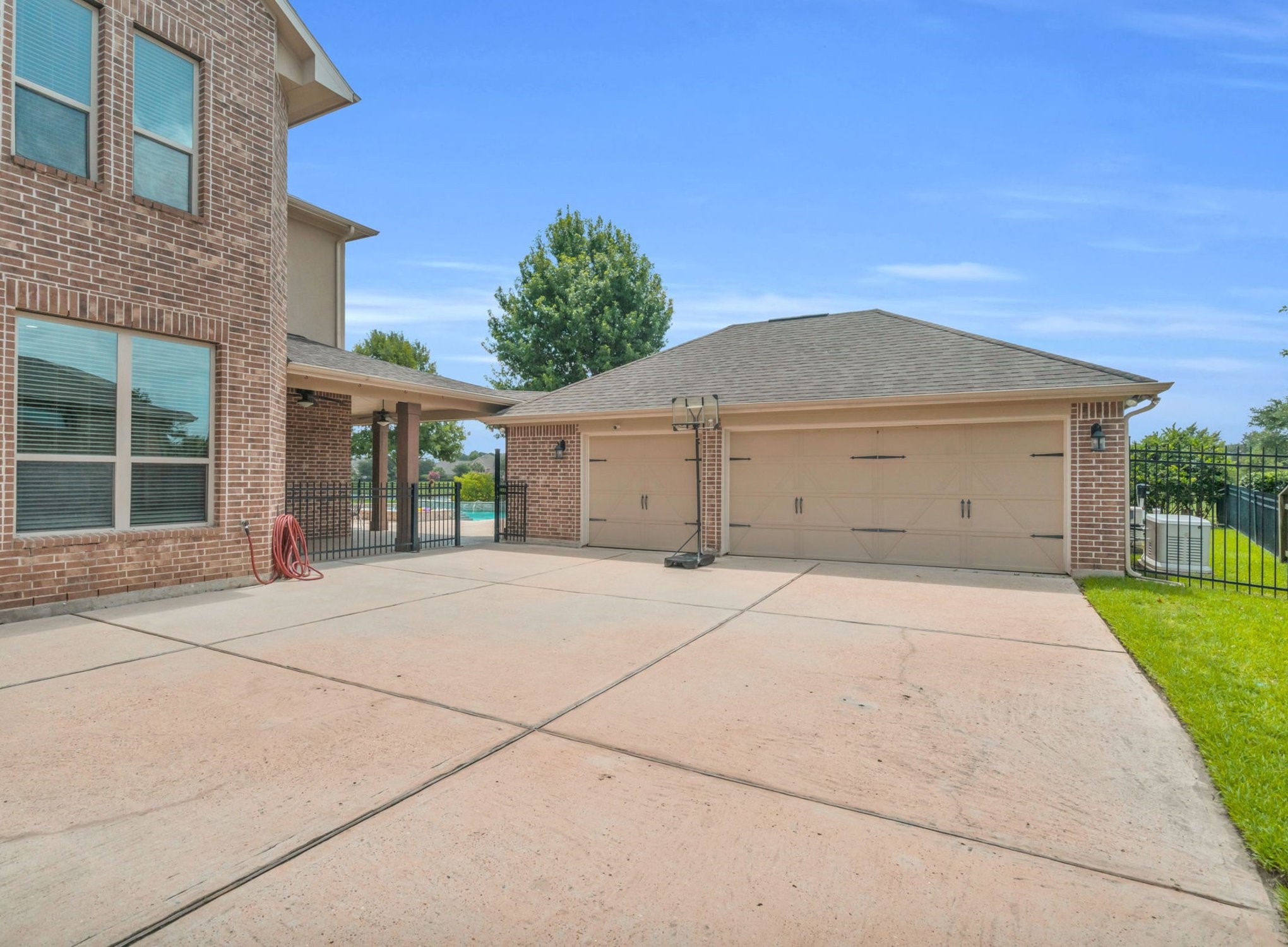 9842 Kirkstone Terrace Drive Spring, TX 77379 - Photo 26 of 34 driveway leading to a three-car garage with lots of extra parking!