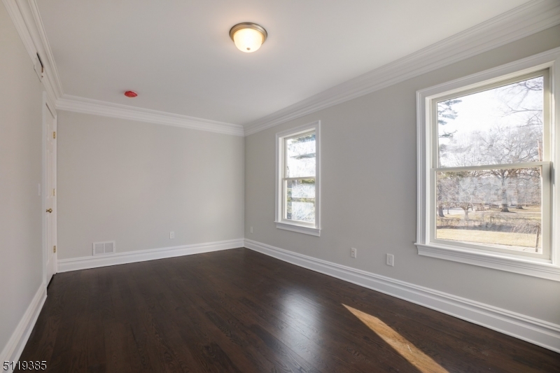 174 Main Street, Unit 2 Madison, NJ 07940 - Photo 11 of 18 wooden floor in an empty room with a window