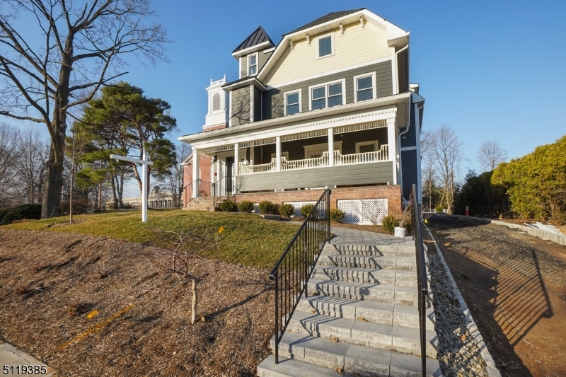 174 Main Street, Unit 2 Madison, NJ 07940 - Photo 17 of 18 a front view of a house with a yard