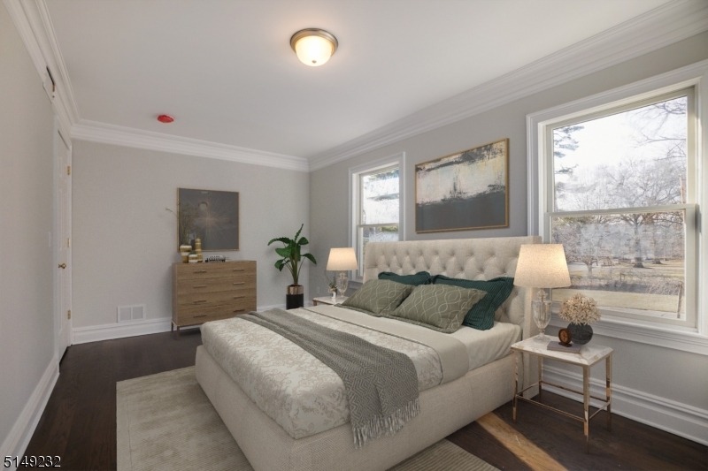 174 Main Street, Unit 2 Madison, NJ 07940 - Photo 10 of 18 a bedroom with a bed and wooden floor