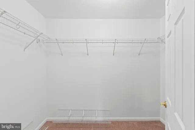 a view of room with window and furniture