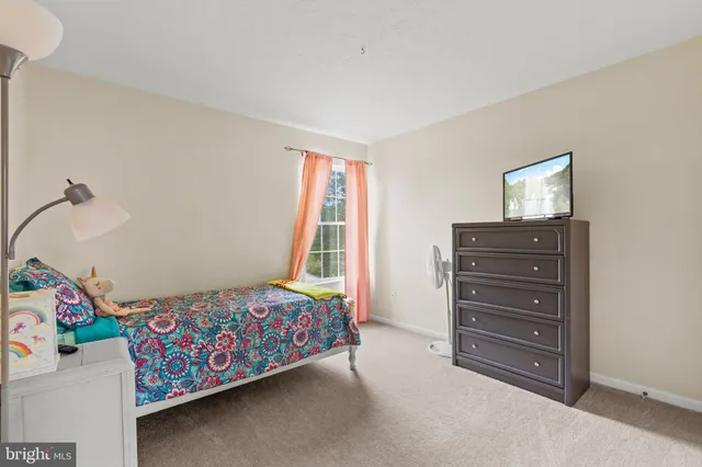 a bed room with a bed and a couch