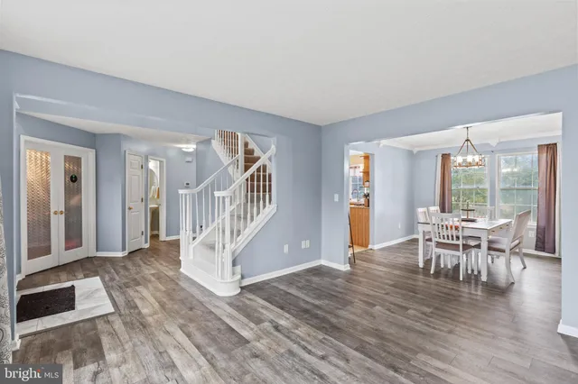 a view of a livingroom with furniture and hardwood floor
