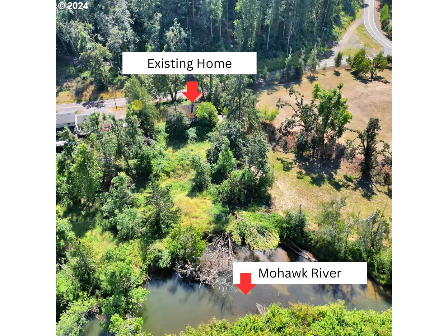 89328 Old Mohawk Road Springfield, OR 97478 - Photo 3 of 12 a sign that is in front of flowers