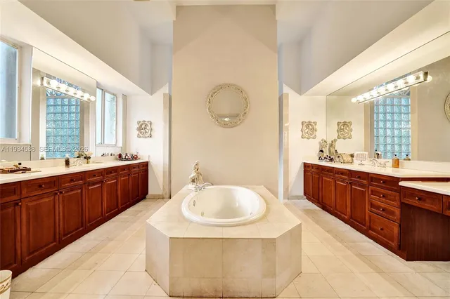 a spacious bathroom with a sink double vanity and a mirror