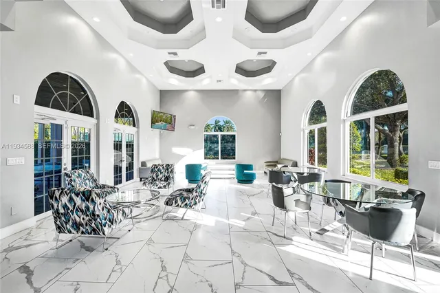 a view of a patio with dining table and chairs