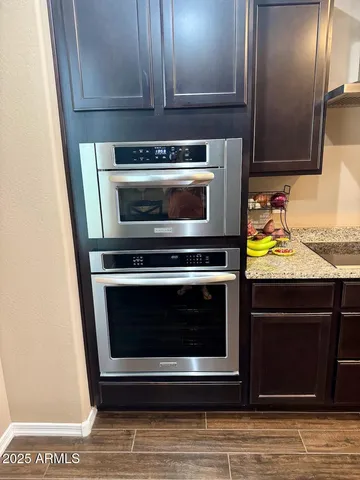 a stove top oven sitting inside of a kitchen