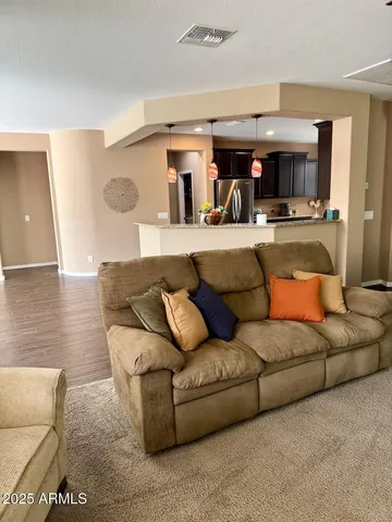a kitchen with a cabinets and wooden floor