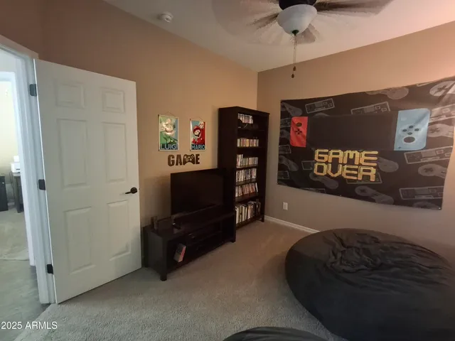 a view of staircase with railing and a window