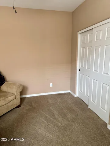 an aerial view of a house with garden space and windows