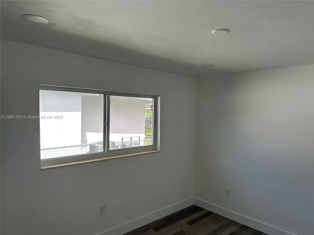 a white toilet sitting next to a bath tub