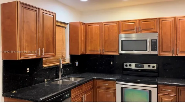 a view of a park with palm trees