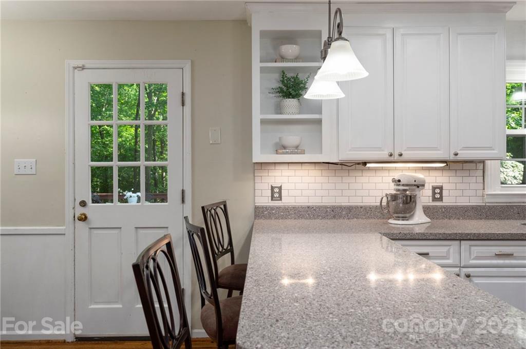 224 Raintree Drive Matthews, NC 28104 - Photo 18 of 48 a kitchen with a table chairs and a window