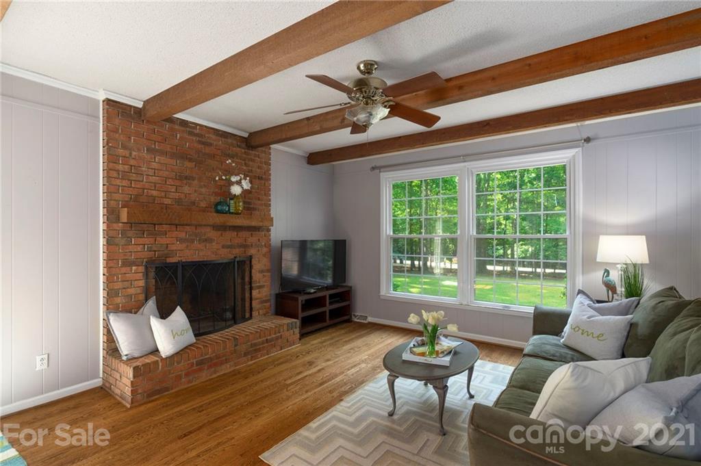 224 Raintree Drive Matthews, NC 28104 - Photo 21 of 48 a living room with furniture and a fireplace
