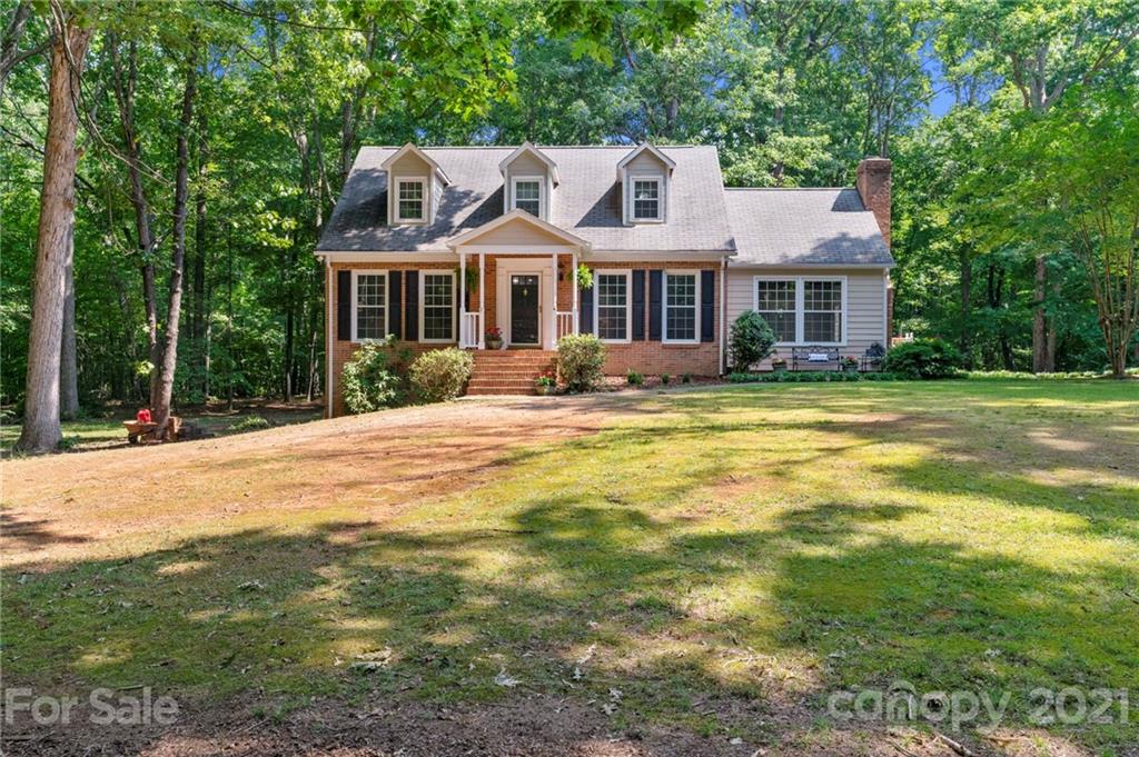 224 Raintree Drive Matthews, NC 28104 - Photo 4 of 48 a front view of a house with a yard
