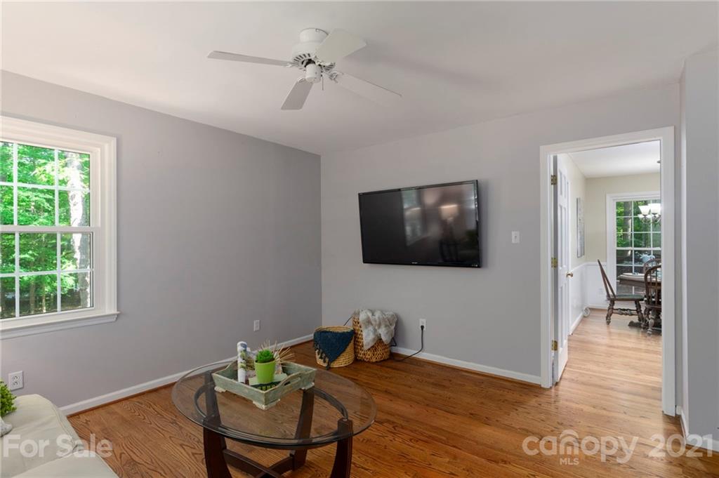 224 Raintree Drive Matthews, NC 28104 - Photo 33 of 48 a living room with furniture and a flat screen tv