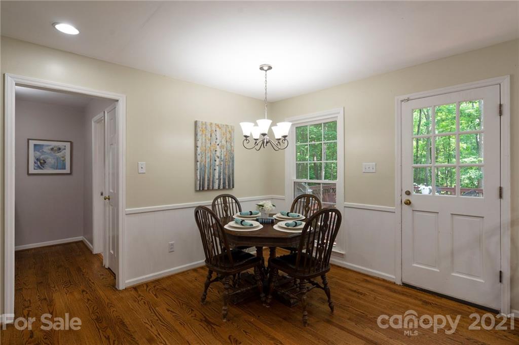 224 Raintree Drive Matthews, NC 28104 - Photo 34 of 48 a view of a dining room with furniture window and wooden floor