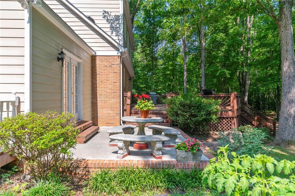 224 Raintree Drive Matthews, NC 28104 - Photo 35 of 48 an aerial view of a house with a yard potted plants and large tree