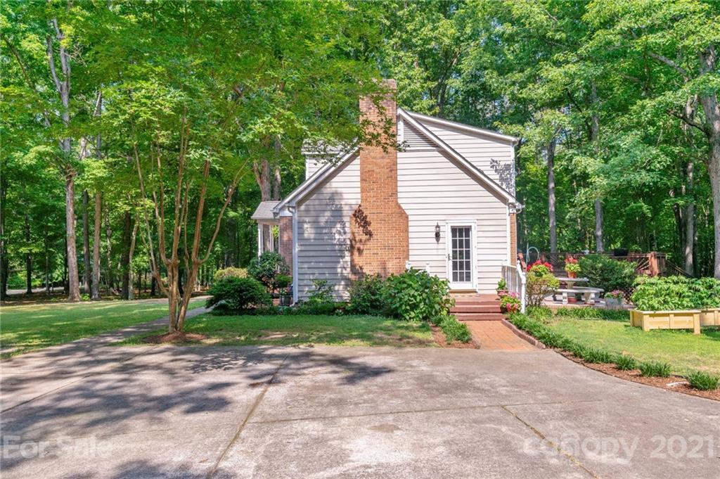224 Raintree Drive Matthews, NC 28104 - Photo 38 of 48 a view of a house with a yard