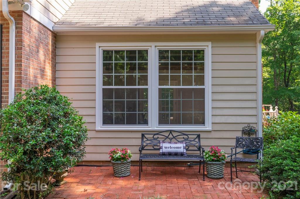 224 Raintree Drive Matthews, NC 28104 - Photo 5 of 48 a front view of a house with a yard