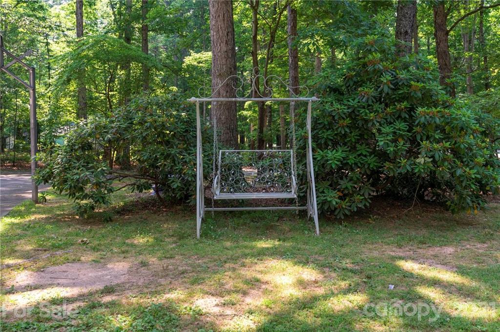 224 Raintree Drive Matthews, NC 28104 - Photo 45 of 48 a view of a backyard with pathway