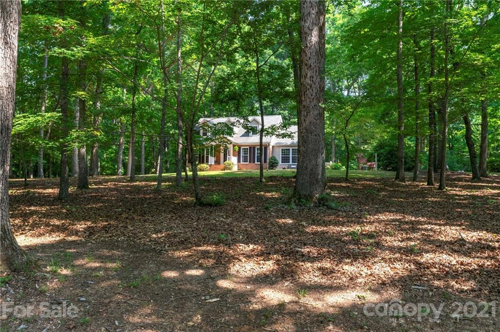 224 Raintree Drive Matthews, NC 28104 - Photo 48 of 48 a view of a house with backyard of a tree