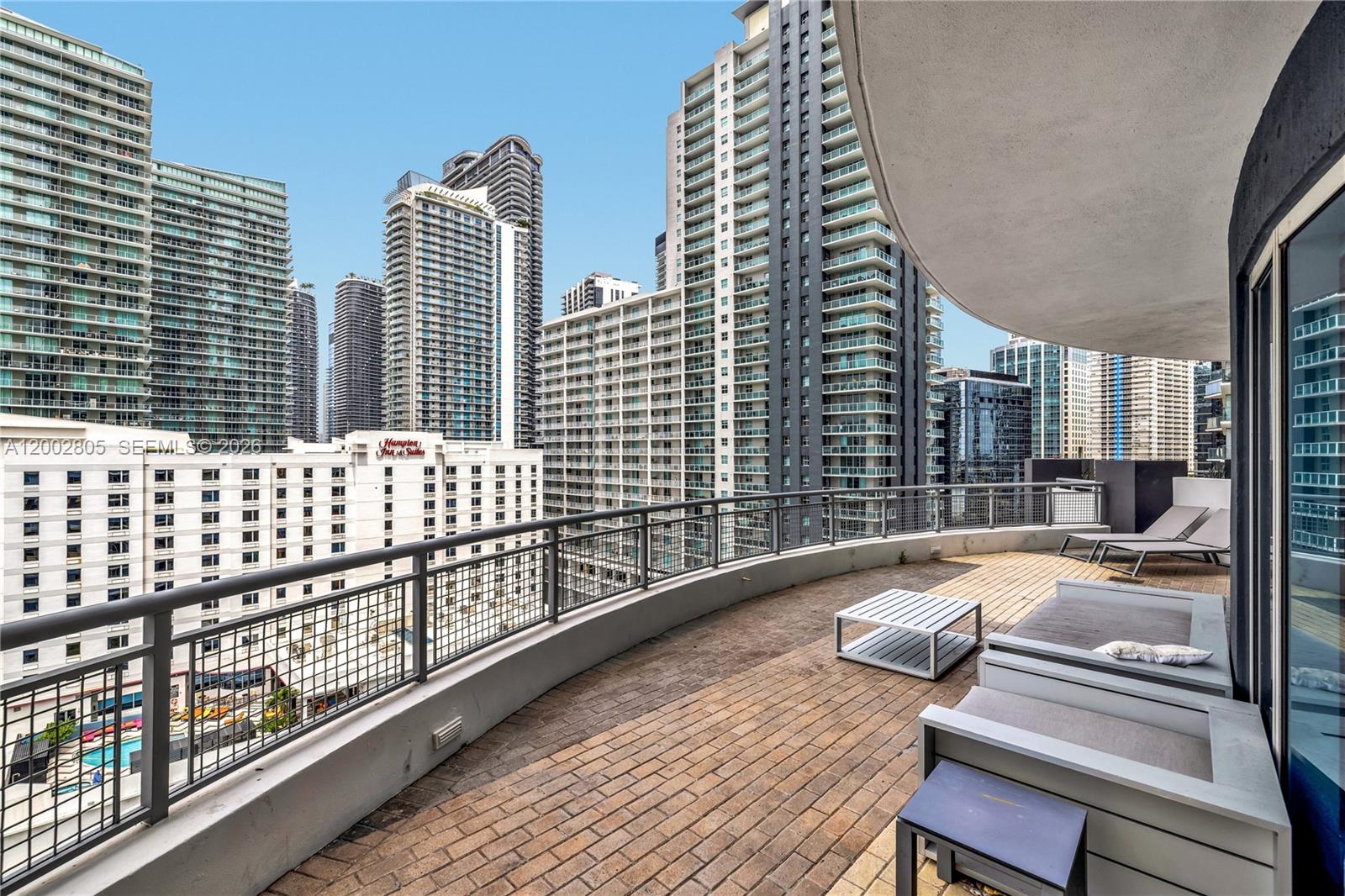 60 Southwest 13th Street, Unit 1124 Miami, FL 33130 - Photo 6 of 30 a balcony with wooden floor