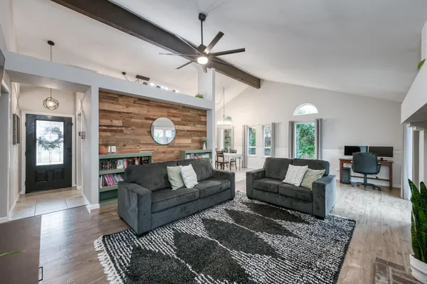 a view of a dining room with furniture window and outside view