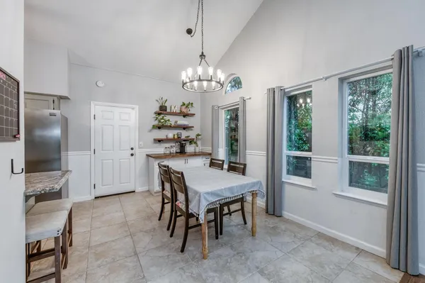 a bathroom with a sink a mirror a toilet and a shower