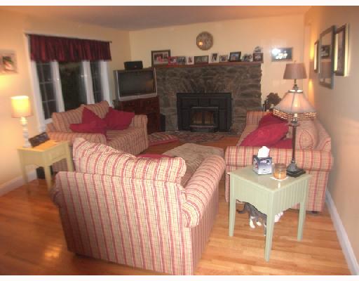 108 Pole Bridge Road Scituate, RI 02857 - Photo 4 of 8 Living Room. Beautiful Hardwoods, Stone Fireplace