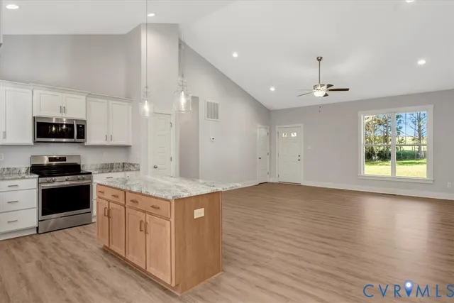 a kitchen with a stove and a sink
