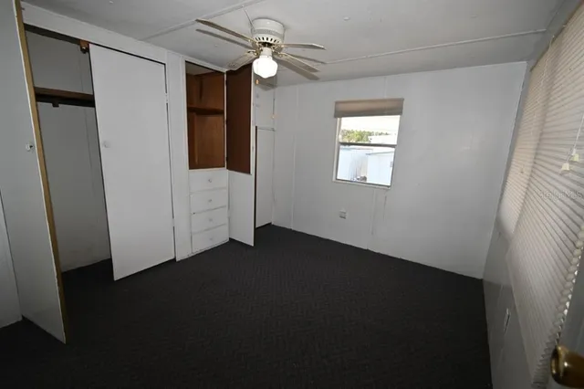 a view of a room that has a couch and a window in it