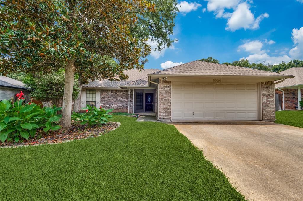 5920 Melstone Drive Arlington, TX 76016 - Photo 1 of 1 a front view of a house with a garden and yard