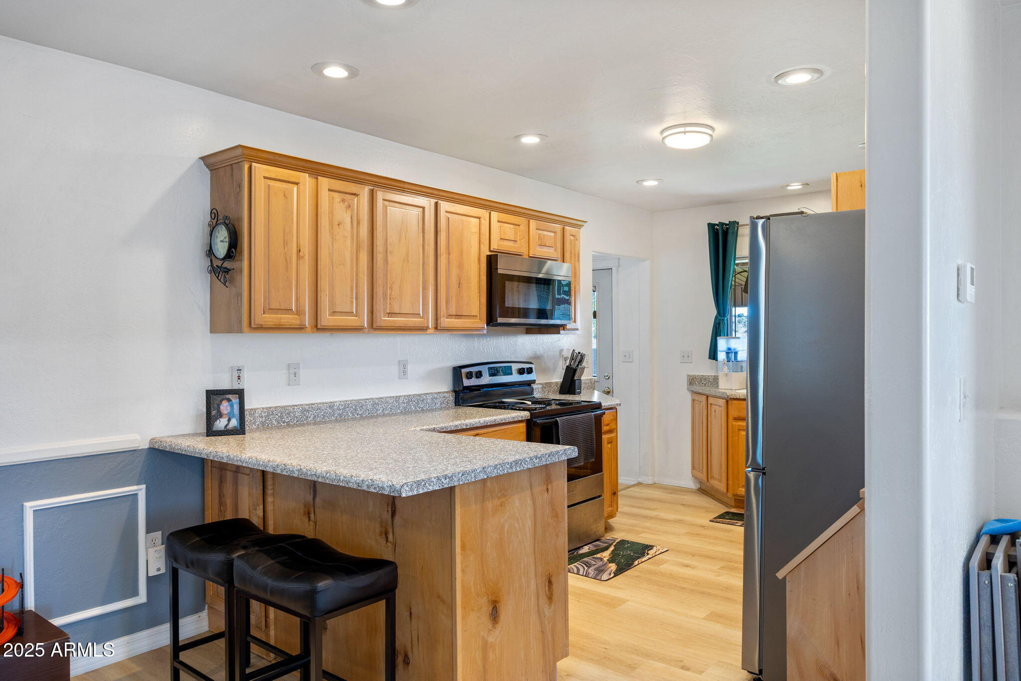 1689 Eager Avenue Snowflake, AZ 85937 - Photo 11 of 45 a kitchen that has a microwave a sink and a stove in it