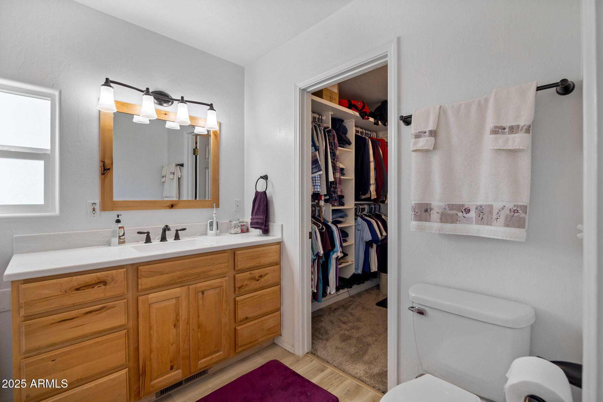 1689 Eager Avenue Snowflake, AZ 85937 - Photo 18 of 45 a bathroom with a toilet sink and mirror