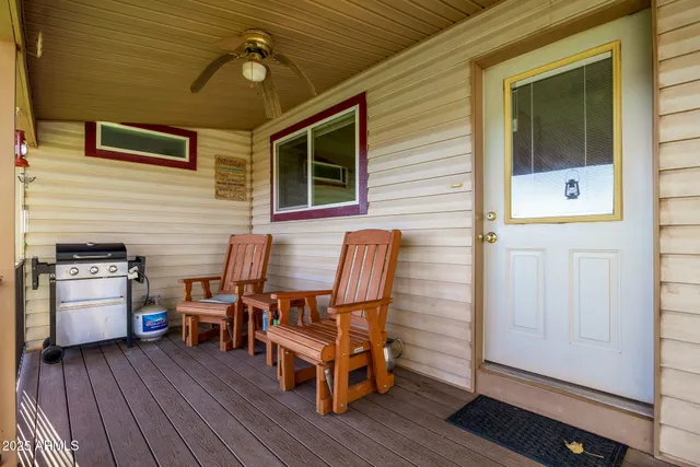 a view of a backyard with sitting area