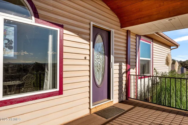 a view of a balcony with wooden floor