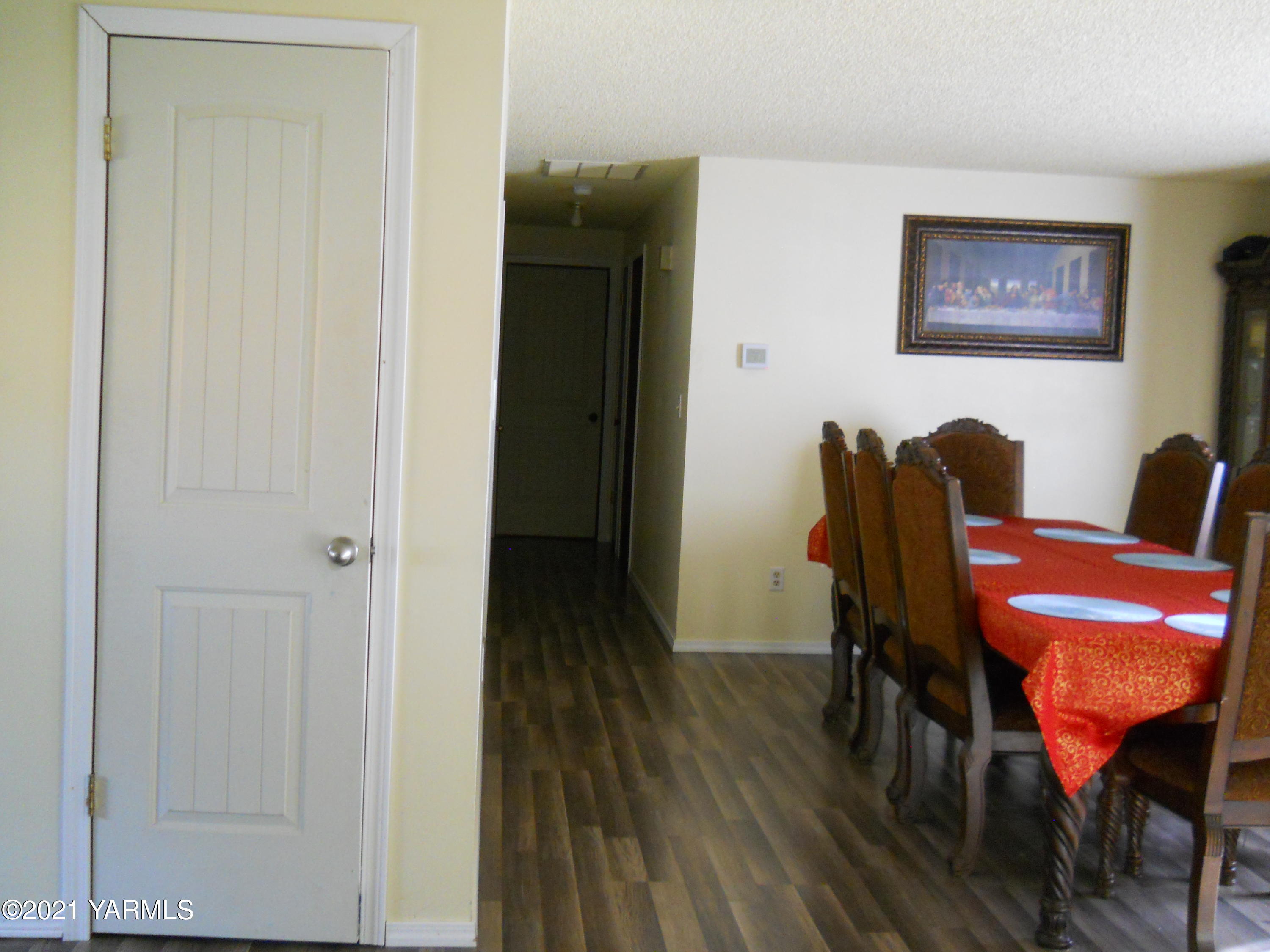 107 East Bonnieview Road Grandview, WA 98930 - Photo 9 of 24 a view of a workspace with furniture and wooden floor
